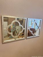 Both mirrors mounted side by side on wall