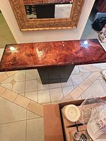Top view of brown marble console table showing surface pattern and gloss