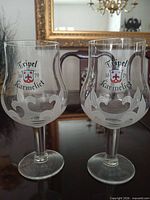 Front view of both Tripel Karmeliet tulip beer glasses