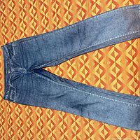 Full view of jeans laid flat
