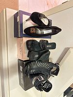All three pairs of shoes on boxes, overview