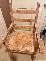 Front view of wooden armchair