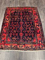 Full view of rug showing entire pattern and borders