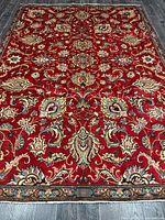 Full view of handmade Tabriz rug showing size and design