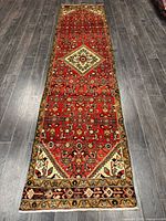 Full view of entire wool runner rug showing pattern and colors