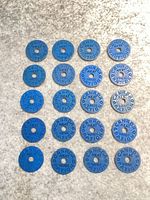 All twenty blue Canadian meat ration tokens laid out showing design and condition