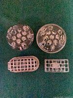 All four flower frogs grouped on table