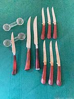 Group shot of all knives and two crystal rests