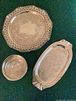 Three silver-plated pieces displayed together