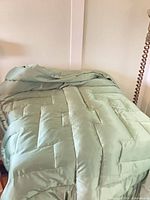 Comforter spread over bed showing overall look and loft