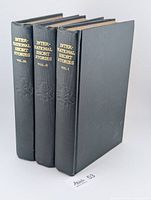 Spine view of all three volumes showing gilt titles and volume numbers