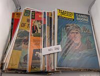 Overall view of stacked bagged comics showing Dell and Classics Illustrated titles