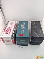 Three Elite Trainer Box inner boxes storing cards