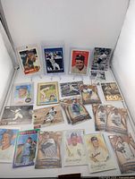 Group shot of all 22 reprint cards in holders