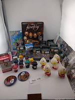 Group shot of all items including Firefly pack, pocket pops, Sailor Moon figures, Mister Rogers figure, ALF buttons, Ultraman figures