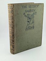 Front cover showing title, illustration, cloth material condition