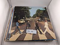 Abbey Road album on top of stack