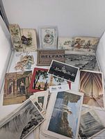 Group shot of assorted postcards and booklets spread out