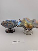 Both carnival glass bowls side by side showing general form and iridescence