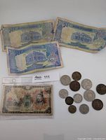 Full lot: three Sudan banknotes, Japanese 5 yen note in sleeve, eleven coins