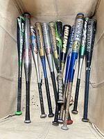 Front view of 12 Easton bats upright showing barrels and grips