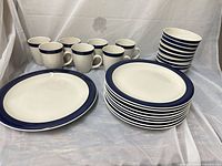 Full lot showing plates, bowls, mugs stacked