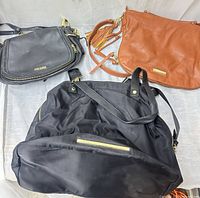 Group shot showing all three Steve Madden purses