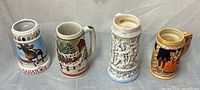 Front view of all four steins