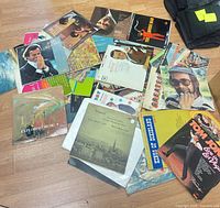Overhead view showing spread of various LP jackets including Julio Iglesias, Exploring Music 4, Tom Jones, etc.
