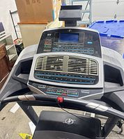 Console view showing display, iFIT logo, control keys, fan grille and safety key