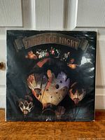 Front cover of Around the World with Three Dog Night double LP in plastic sleeve