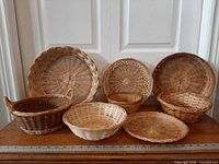 Front view showing all eight baskets lined up for size and style reference