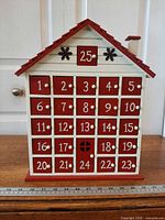 Front view showing all numbered drawers and house shape