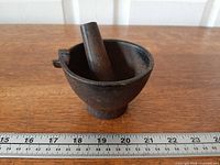 Mortar and pestle with ruler showing approx. 4 in. diameter