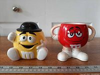 Both M&M character pieces side by side with scale