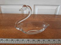 Profile view of clear crystal swan dish showing overall shape and scale with ruler