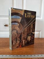 Front and spine view of the hardcover book standing upright