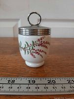 Side view showing full decoration and chrome lid