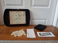Open folio showing board, tiles, bag, score pad