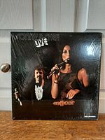 Front cover showing title and artists in shrink wrap