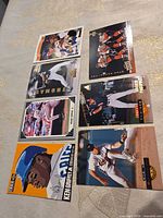 Front view of eight trading cards laid out