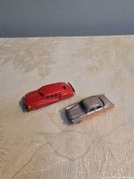 Top view of both diecast cars, showing colors and general wear