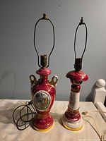Front view of both porcelain lamps showing shapes, glaze and harps