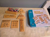 Full set with tin, boards and peg bag displayed