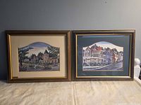 Both framed prints side by side