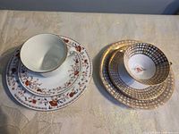 Two pattern tea sets stacked