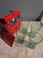Open red Coca-Cola/McDonald’s box with four heritage glasses