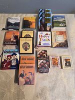 All sixteen miniature books arranged in grid