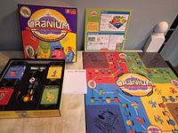 Box, board, rule sheet and contents overview