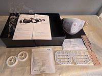 All items laid out: mask, manuals, accessories